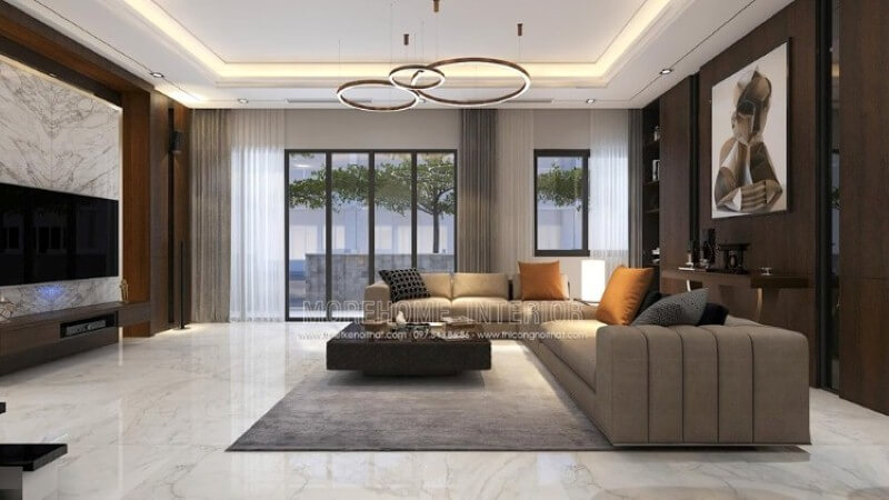 Bố trí nội thất phòng khách biệt thự rộng nổi bật với phong cách hiện đại nổi bật bộ sofa góc lớn cách điệu với đường kẻ sọc trang trí đẹp mắt. Trang trí nội thất chung cư